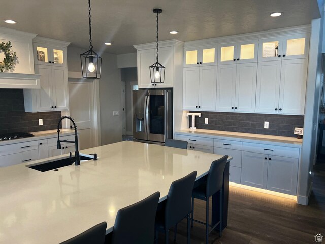 2346 Lake Cir, Preston, ID 83263 - kitchen featuring stainless steel fridge with ice dispenser, tasteful backsplash, light countertops, recessed lighting, and decorative light fixtures