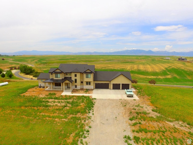 2346 Lake Cir, Preston, ID 83263 - modern inspired farmhouse with driveway, an attached garage, a view of countryside, and a mountain view