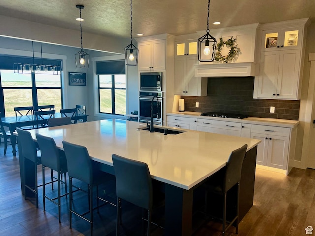 2346 Lake Cir, Preston, ID 83263 - kitchen with appliances with stainless steel finishes, decorative backsplash, white cabinets, dark wood finished floors, and glass insert cabinets