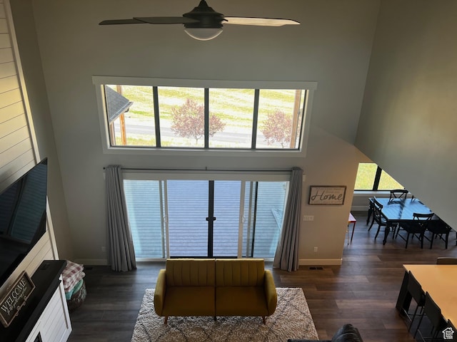 2346 Lake Cir, Preston, ID 83263 - living room with dark wood-style floors, a ceiling fan, and a towering ceiling