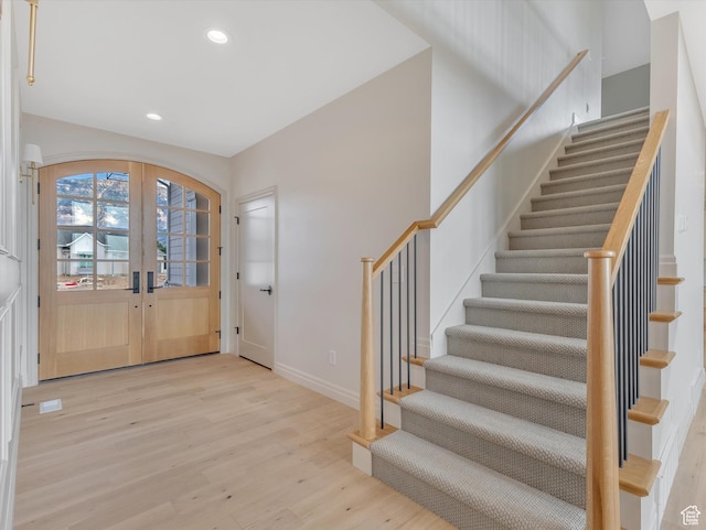 1395 N 330 E Unit 3, Orem, UT 84057 - entrance foyer featuring wood finished floors, stairs, recessed lighting, french doors, and arched walkways