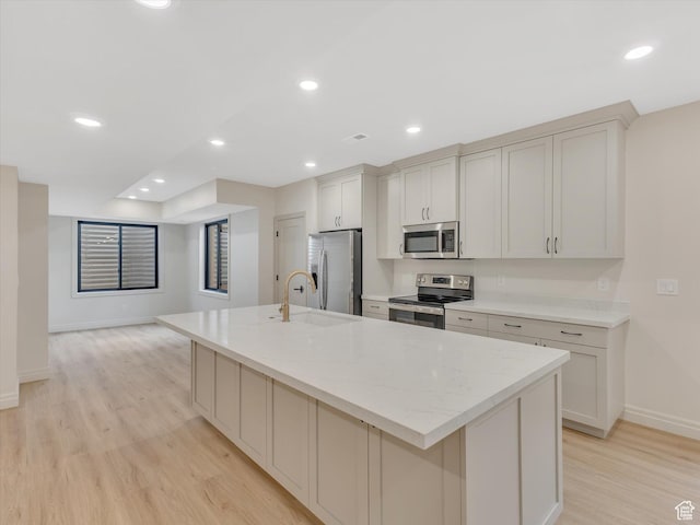 1395 N 330 E Unit 3, Orem, UT 84057 - kitchen featuring appliances with stainless steel finishes, light wood-style flooring, a large island, light stone counters, and recessed lighting