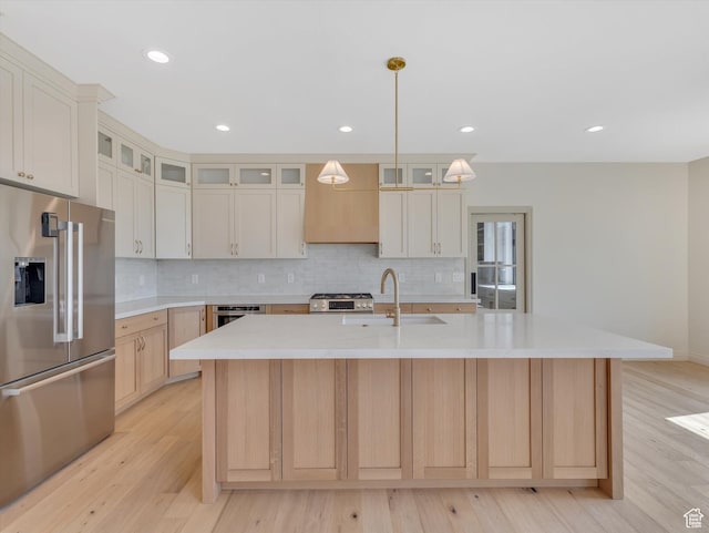 1395 N 330 E Unit 3, Orem, UT 84057 - kitchen with high end fridge, light wood-style floors, tasteful backsplash, an island with sink, and recessed lighting