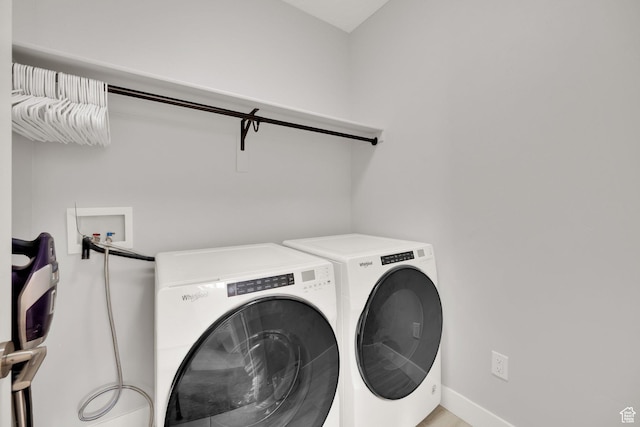 10376 S Beetdigger Blvd, Sandy, UT 84070 - washroom with washer and clothes dryer and baseboards