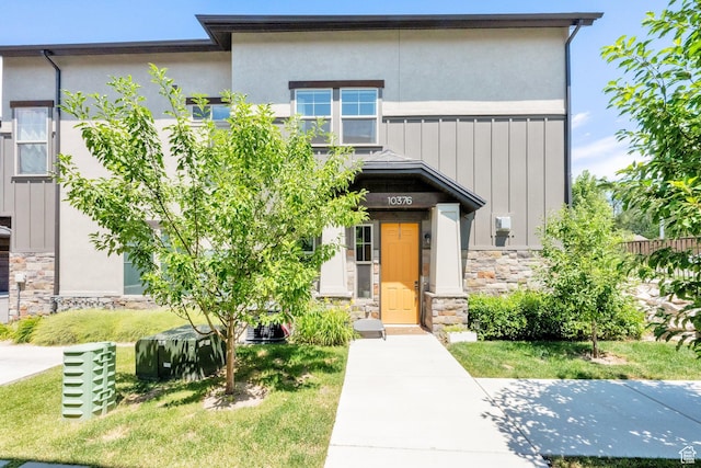10376 S Beetdigger Blvd, Sandy, UT 84070 - view of front of property with stone siding, board and batten siding, and stucco siding