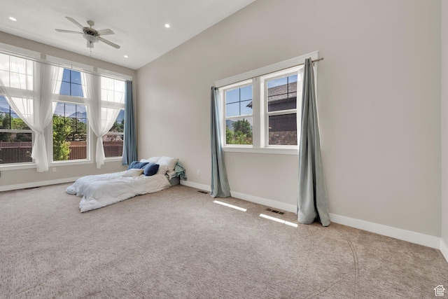 10376 S Beetdigger Blvd, Sandy, UT 84070 - unfurnished bedroom featuring multiple windows, carpet, vaulted ceiling, recessed lighting, and a ceiling fan