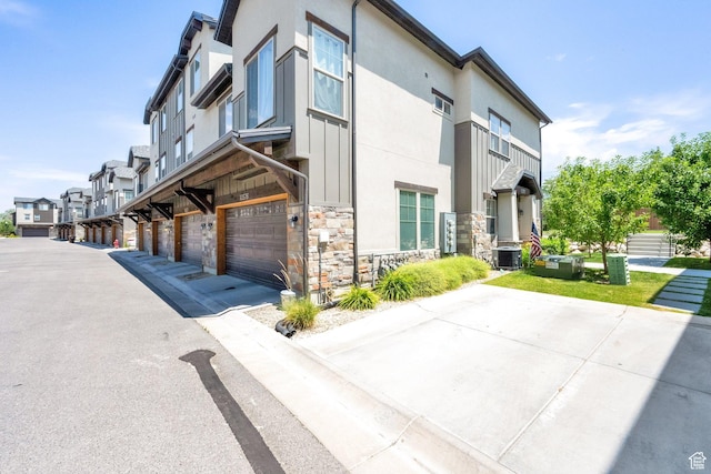 10376 S Beetdigger Blvd, Sandy, UT 84070 - view of building exterior with a residential view and an attached garage