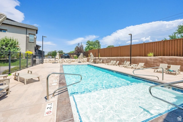 10376 S Beetdigger Blvd, Sandy, UT 84070 - community pool featuring a patio area