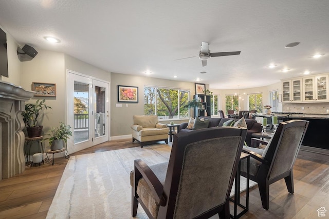 10025 Silver Streak Dr, South Jordan, UT 84095 - living area featuring wood finished floors, healthy amount of natural light, a ceiling fan, and recessed lighting
