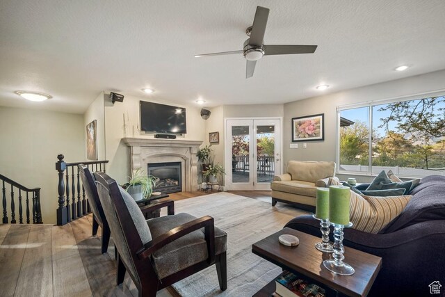 10025 Silver Streak Dr, South Jordan, UT 84095 - living area featuring wood finished floors, plenty of natural light, ceiling fan, a fireplace, and recessed lighting