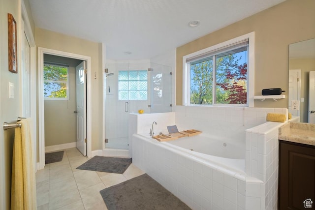 10025 Silver Streak Dr, South Jordan, UT 84095 - bathroom with vanity, a shower stall, a tub with jets, and tile patterned flooring