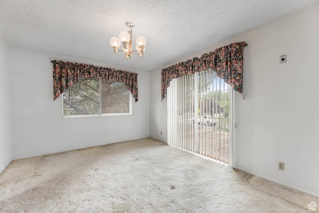 8614 S Buena Vista Dr E, Sandy, UT 84094 - empty room with a chandelier, carpet, and a textured ceiling