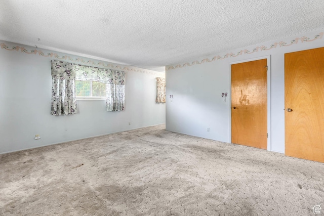 8614 S Buena Vista Dr E, Sandy, UT 84094 - empty room featuring a textured ceiling and carpet flooring
