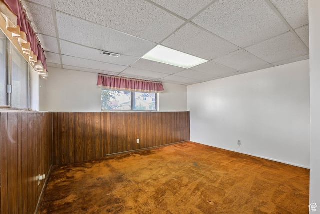 8614 S Buena Vista Dr E, Sandy, UT 84094 - carpeted spare room with wood walls, a drop ceiling, and wainscoting