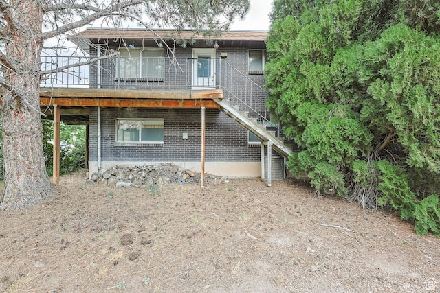 8614 S Buena Vista Dr E, Sandy, UT 84094 - view of front of property with brick siding and stairs