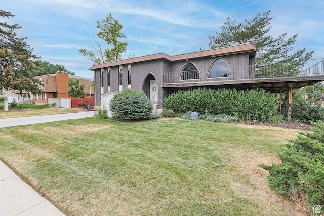 8614 S Buena Vista Dr E, Sandy, UT 84094 - view of front of property with driveway, a front yard, brick siding, and a chimney