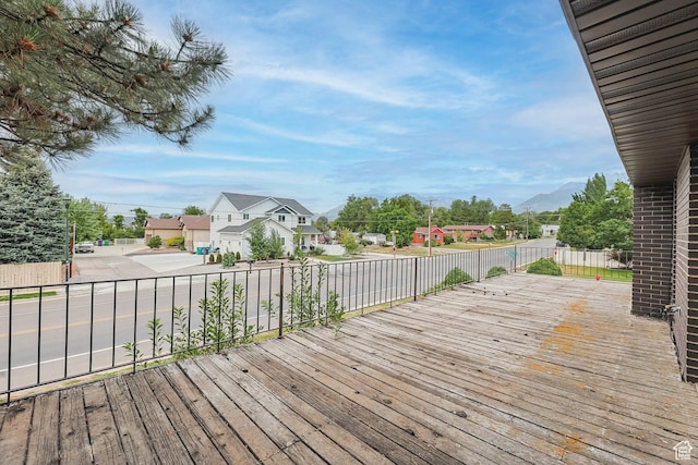 8614 S Buena Vista Dr E, Sandy, UT 84094 - wooden terrace with a residential view and a mountain view