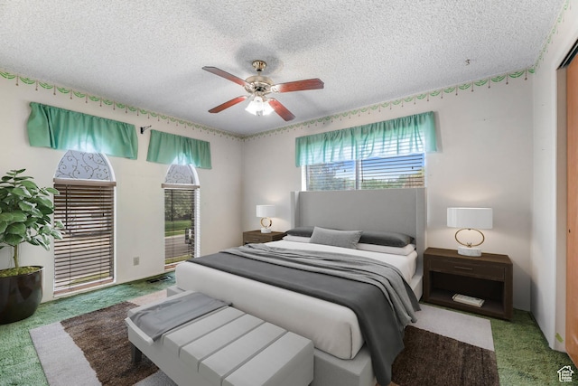 8614 S Buena Vista Dr E, Sandy, UT 84094 - bedroom featuring carpet flooring, a textured ceiling, and a ceiling fan