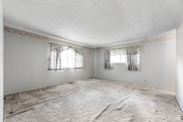 8614 S Buena Vista Dr E, Sandy, UT 84094 - empty room with carpet flooring and a textured ceiling