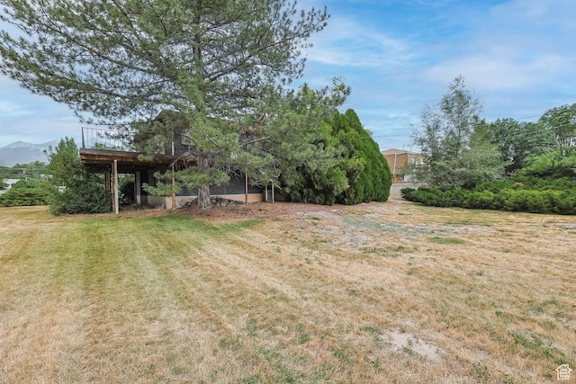 8614 S Buena Vista Dr E, Sandy, UT 84094 - view of grassy yard with a deck