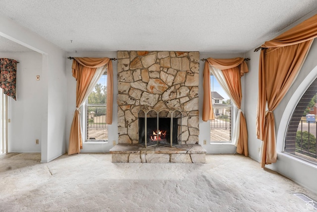 8614 S Buena Vista Dr E, Sandy, UT 84094 - unfurnished living room with a textured ceiling, carpet floors, and a fireplace