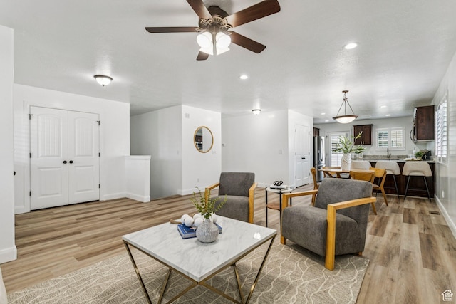644 E 780 S, Heber City, UT 84032 - living area with light wood-type flooring, ceiling fan, and recessed lighting