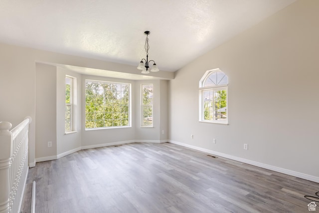 364 W 1330 N, Logan, UT 84341 - unfurnished living room featuring a chandelier and wood finished floors