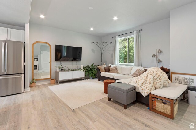 1288 Lincoln Ave, Ogden, UT 84404 - living room with light wood-style flooring, recessed lighting, and arched walkways