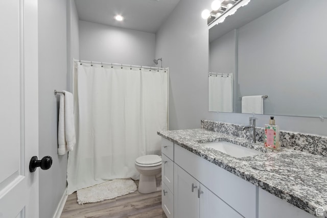 1288 Lincoln Ave, Ogden, UT 84404 - bathroom with vanity, wood finished floors, shower / tub combo, and recessed lighting