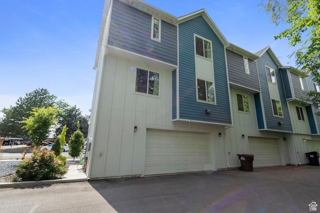 1288 Lincoln Ave, Ogden, UT 84404 - rear view of house featuring board and batten siding and an attached garage
