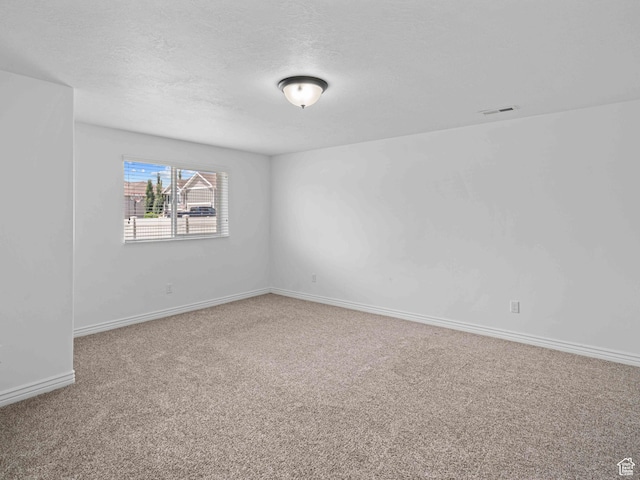 3552 S 5250 W Unit 13, Hooper, UT 84315 - carpeted spare room with a textured ceiling and baseboards