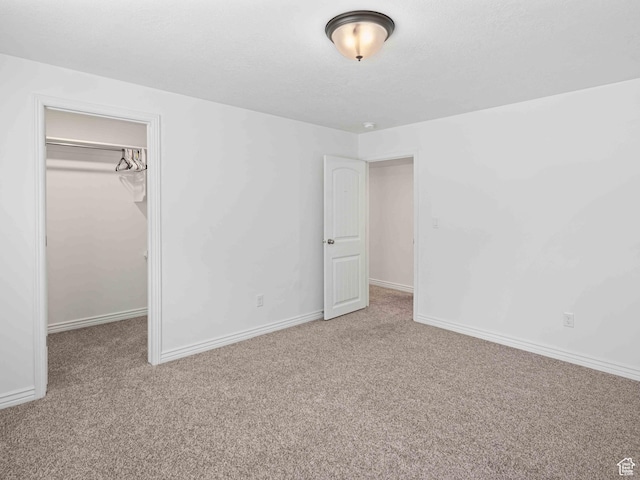 3552 S 5250 W Unit 13, Hooper, UT 84315 - unfurnished bedroom featuring carpet flooring, a walk in closet, and a closet