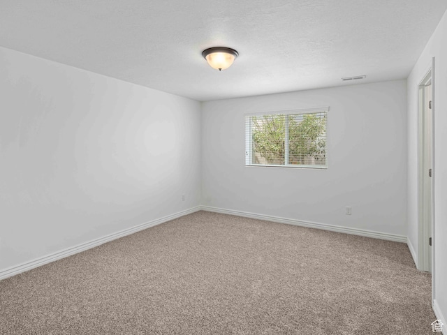 3552 S 5250 W Unit 13, Hooper, UT 84315 - carpeted spare room featuring a textured ceiling