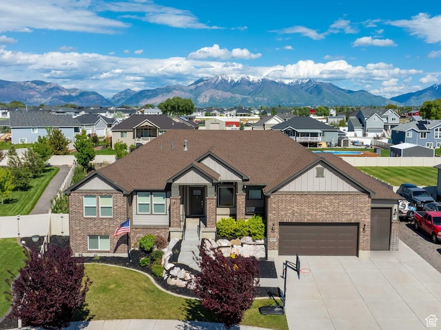 3552 S 5250 W Unit 13, Hooper, UT 84315 - view of front of house featuring brick siding, a residential view, a garage, and a mountain view