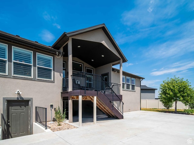 3552 S 5250 W Unit 13, Hooper, UT 84315 - view of front facade featuring stucco siding, stairs, and a patio