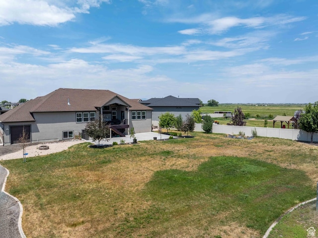 3552 S 5250 W Unit 13, Hooper, UT 84315 - rear view of property with stucco siding and a patio area