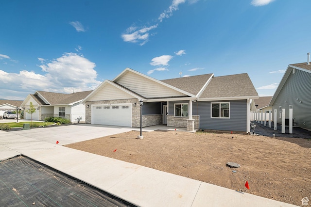 318 E 290 N, Preston, ID 83263 - view of front of home featuring an attached garage, driveway, and stone siding