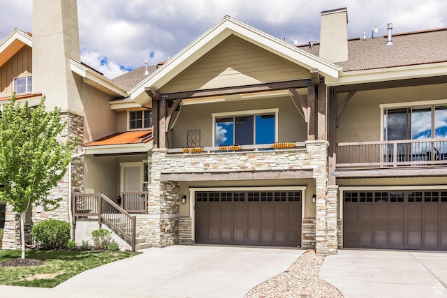 538 W Heritage Way, Heber City, UT 84032 - view of front of property with stone siding, stucco siding, a chimney, and concrete driveway