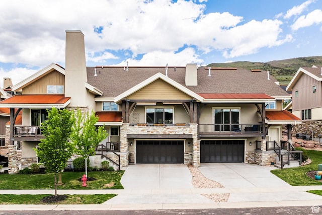538 W Heritage Way, Heber City, UT 84032 - view of property featuring stucco siding, stone siding, an attached garage, concrete driveway, and a chimney