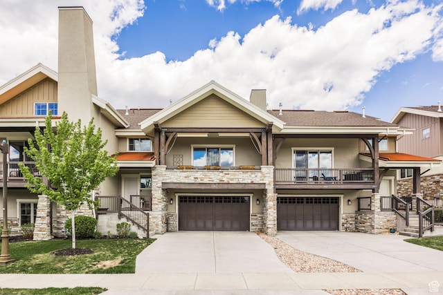 538 W Heritage Way, Heber City, UT 84032 - view of front of property with stucco siding, stone siding, a chimney, driveway, and a garage
