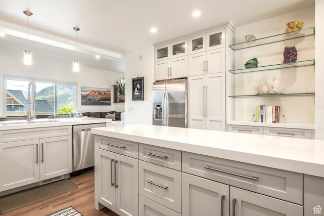 538 W Heritage Way, Heber City, UT 84032 - kitchen featuring stainless steel appliances, dark wood-style floors, decorative light fixtures, recessed lighting, and glass insert cabinets