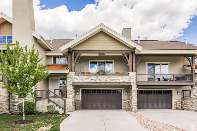 538 W Heritage Way, Heber City, UT 84032 - view of property with stucco siding, stone siding, an attached garage, driveway, and roof with shingles
