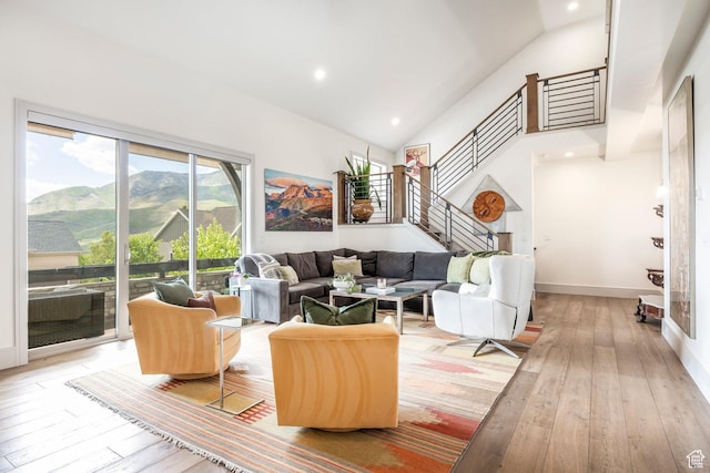538 W Heritage Way, Heber City, UT 84032 - living room featuring light wood finished floors, high vaulted ceiling, stairs, recessed lighting, and a mountain view