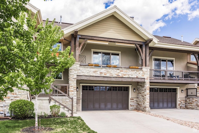 538 W Heritage Way, Heber City, UT 84032 - view of front of house featuring stone siding, stucco siding, an attached garage, driveway, and a balcony