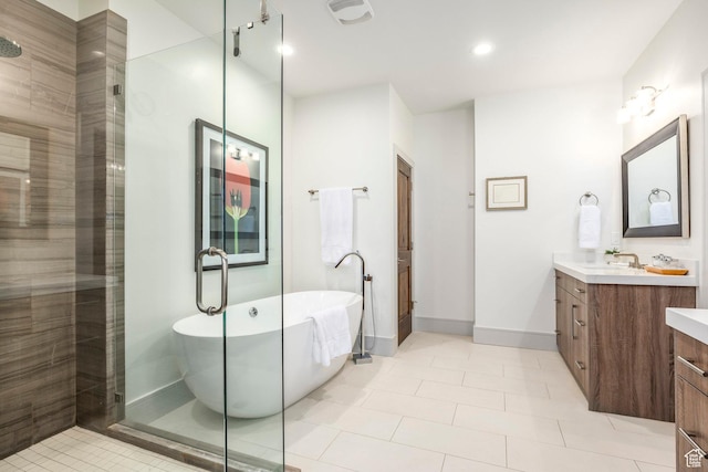 538 W Heritage Way, Heber City, UT 84032 - bathroom featuring vanity, tiled shower, a freestanding bath, tile patterned floors, and recessed lighting