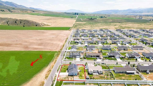 496 S 1600 E, Hyrum, UT 84319 - aerial perspective of suburban area with property parcel outlined and a mountainous background