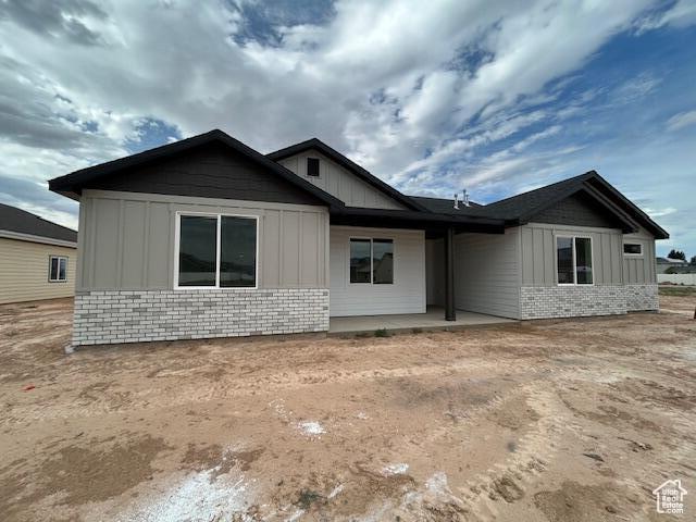 1966 W 4750 N Unit 7, Enoch, UT 84721 - view of side of property with board and batten siding and brick siding
