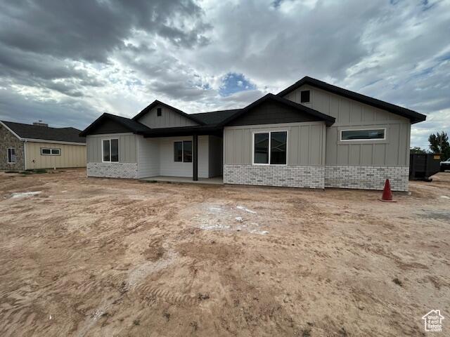 1966 W 4750 N Unit 7, Enoch, UT 84721 - view of front of house featuring board and batten siding and brick siding