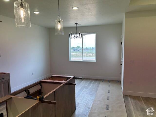 1966 W 4750 N Unit 7, Enoch, UT 84721 - unfurnished dining area featuring light wood-type flooring, recessed lighting, and a chandelier