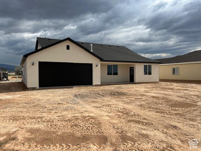 1966 W 4750 N Unit 7, Enoch, UT 84721 - view of front of home with stucco siding and a garage